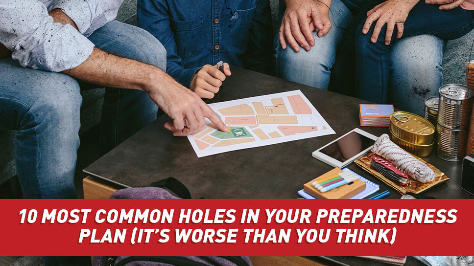 A family sitting around a coffee table going over an emergency plan.