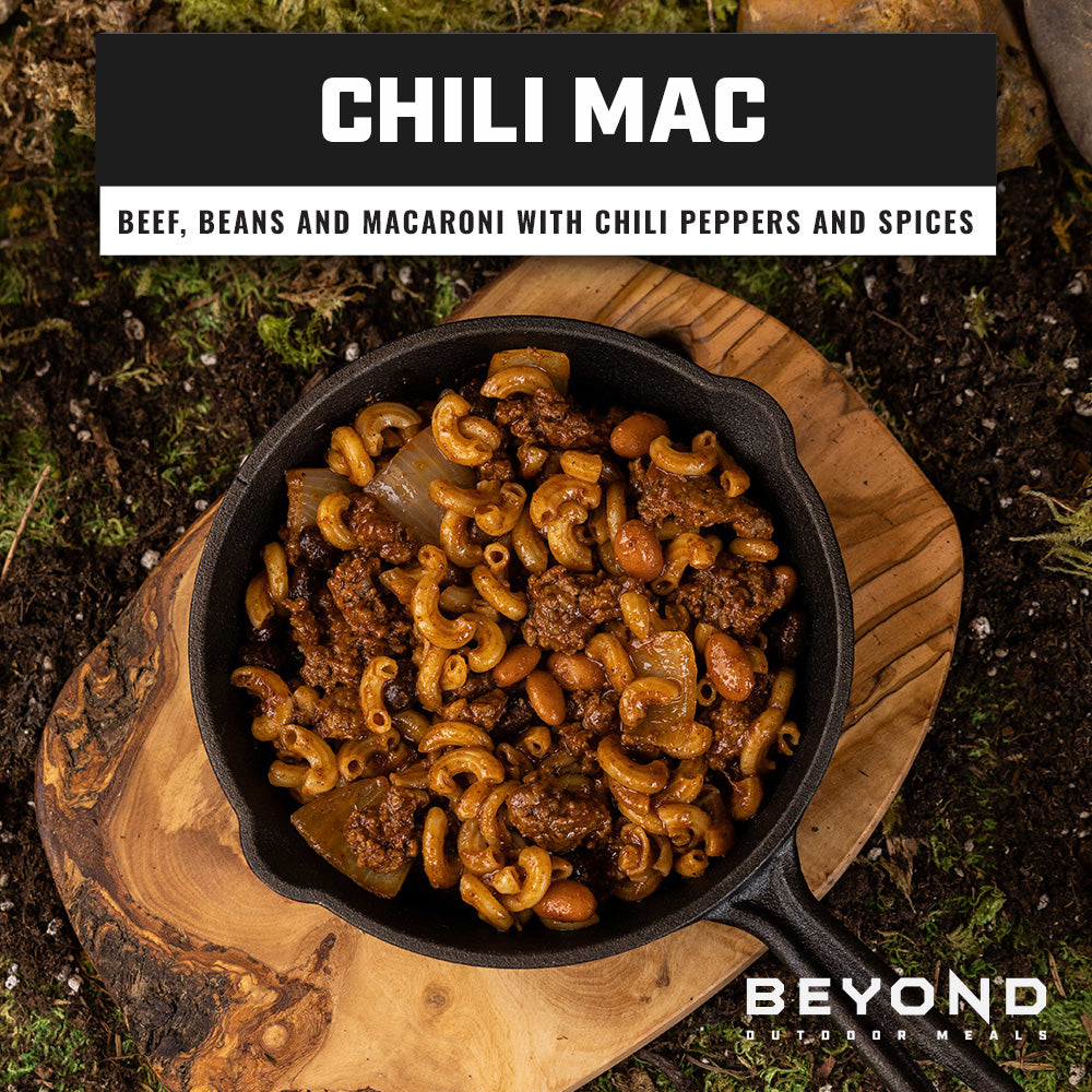Beyond Outdoor Meals Chili Mac with beef, beans, macaroni, chili peppers and spices served in a cast-iron skillet.