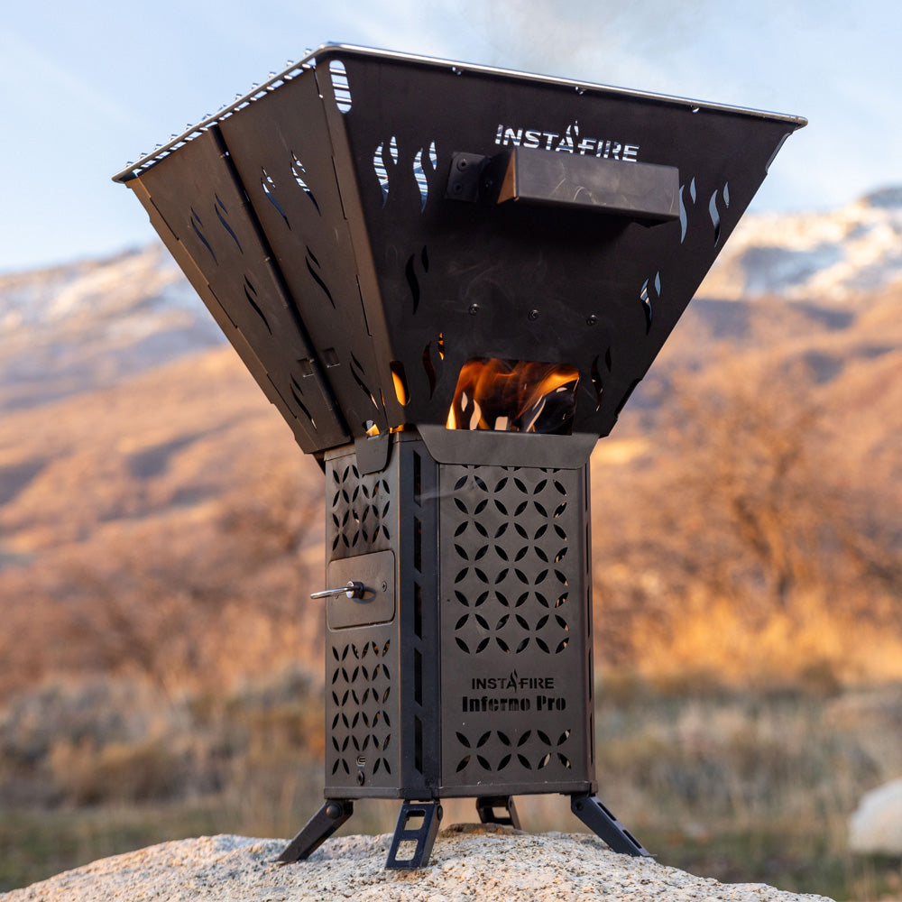 InstaFire Inferno Pro stove with flames on a mountain background