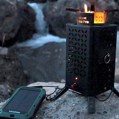 InstaFire Inferno Pro Stove powered by USB while charging from a portable solar panel outdoors