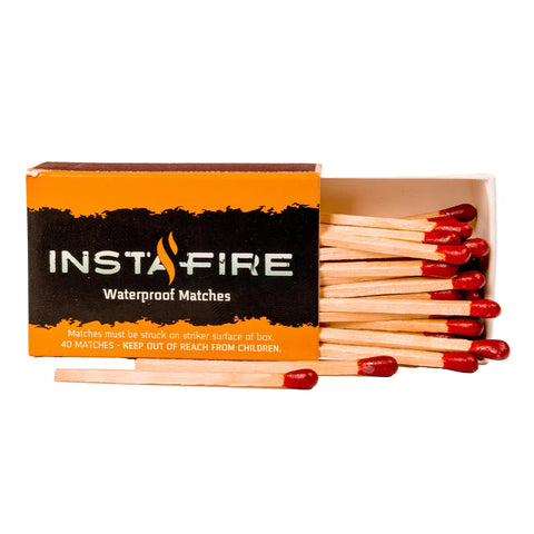 Image of One box of InstaFire Waterproof Matches, opened with matches falling out. Packaging is orange and black and matches have a red tip.