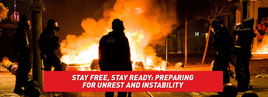 Silhouettes of police officers and citizens while a city burns into flames.