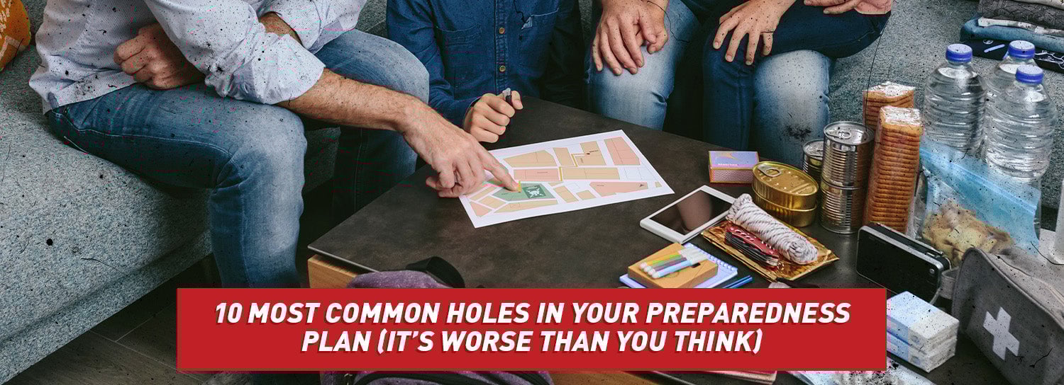 A family sitting around a coffee table going over an emergency plan.