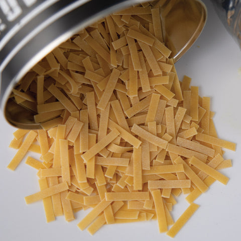 Image of Ready Hour Egg Noodles dumped on table.