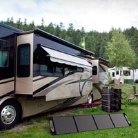 Thumbnail for Grid Doctor "power tower" (one 2200 battery and 2200XP batteries connected) and solar panel being used to power an RV. 