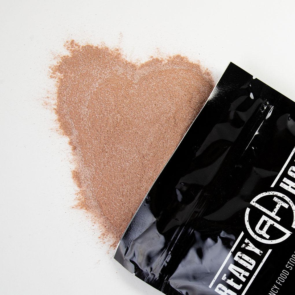 Black Ready Hour Chocolate Pudding pouch, angled view showing the red logo.