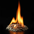 InstaFire Fire Starter & Fuel burning with tall orange flames against a black background.