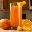 Ready hour orange energy drink in a tall glass with a sliced orange