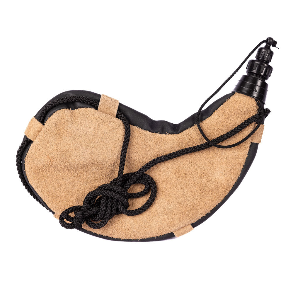 Tan leather bota bag with a black carrying cord on a white background.