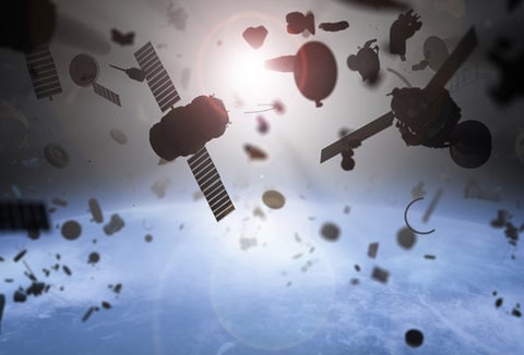 Small pieces of old satellites and other "space junk" floating in the Earth's orbit.
