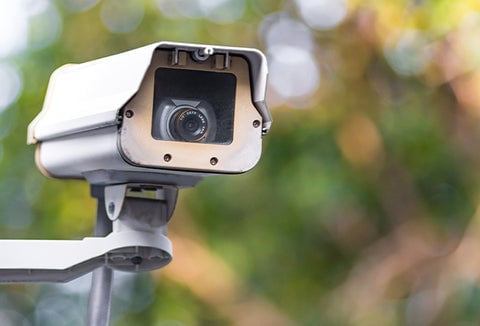 A large street camera being used to monitor activities.