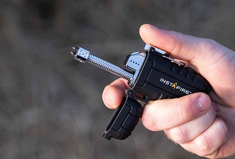 A person using a Pocket Plasma Lighter.