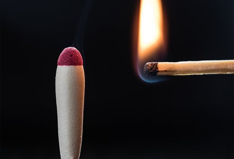 Lighting a waterproof match.