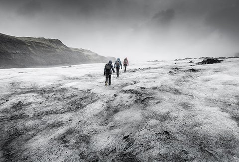 Survivors walking across a glacier to their rescue.