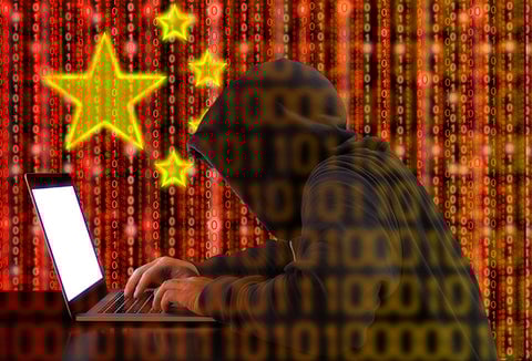 A hacker breaking into a computer system.