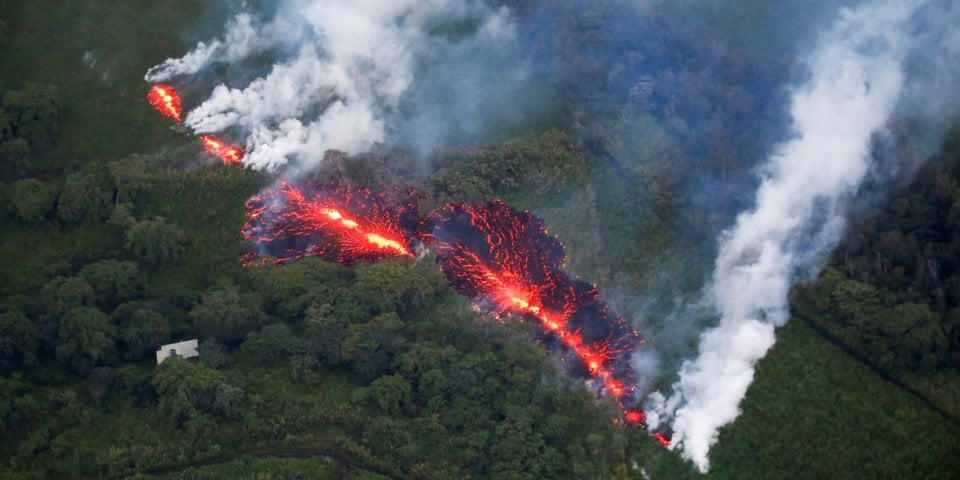Lava erupts from a fissure east of the Leilani Estates subdivision during ongoing eruptions of the Kilauea Volcano in Hawaii, U.S., May 13, 2018.REUTERS/Terray Sylvester