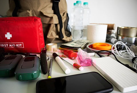 An array of emergency supplies placed on a table.