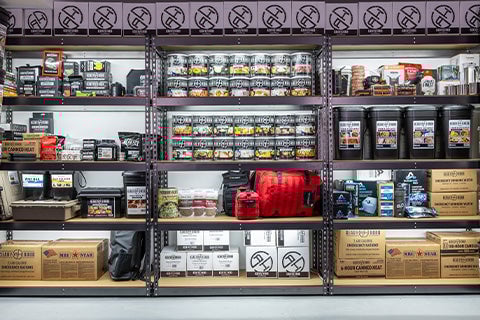 Shelves of emergency food and gear.