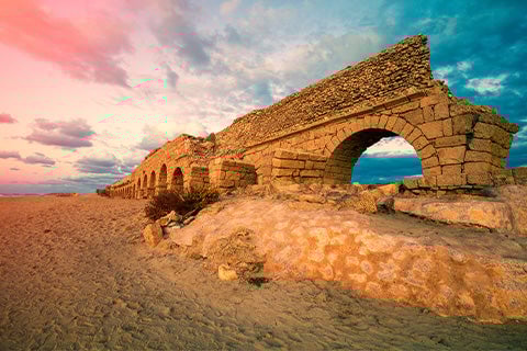 An ancient, crumbling wall in the desert.